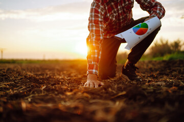 Hand of expert farmer collect soil and checking soil health before growth a seed of vegetable or...