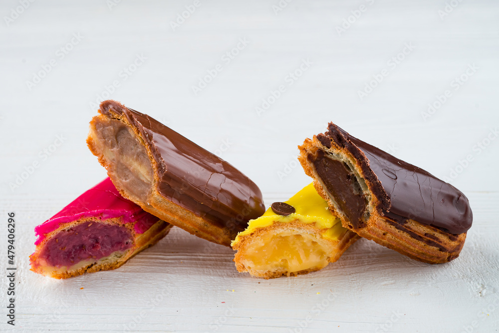 Poster multicolored glazed eclairs decorated. sweet dessert.