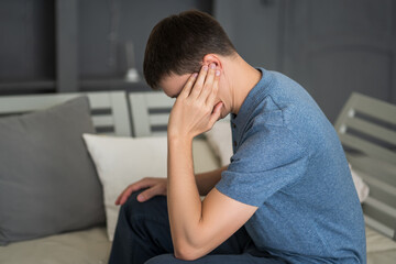 Man with earache, ear pain at home
