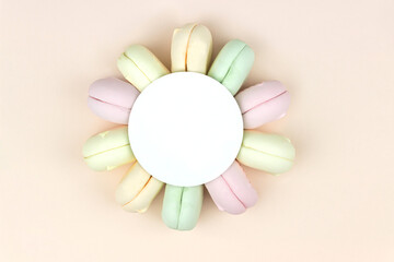 Delicious Sweet Colorful Marshmallow Macarons with round copy space. Top view. Free space for text.