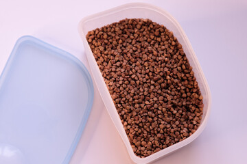 Container with buckwheat groats