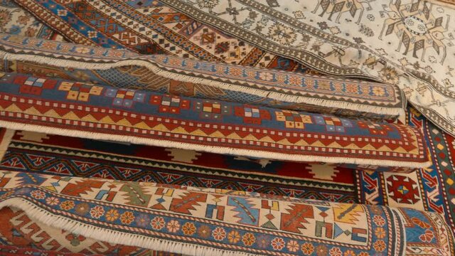 Beautiful handmade carpets from Asian countries are shown at the exhibition. Shot in motion. Closeup