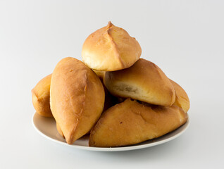 fresh pies on a plate on a white background