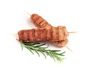 grilled lula kebab on skewers with spices on white background, isolate