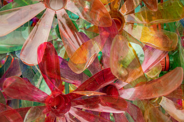flowers made from painted PET bottles - closeup texture background