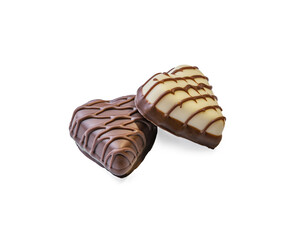 dark and white chocolate candies in the shape of hearts isolated on white