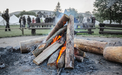 Campfire in a scout tent camp