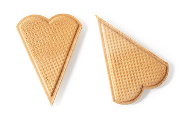 Two heart shaped wafers for ice cream decoration isolated on a white background. Thin flat waffle...