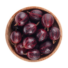heap pf red gooseberries in wooden cup isolated on white. top view