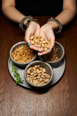hands holding a bowl snack