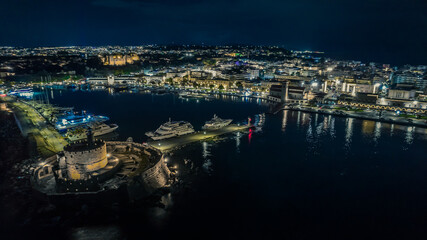Aerial drone view of Rhodes town center during night - obrazy, fototapety, plakaty