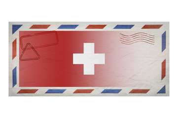 Postal envelope. Envelope with the image flag of Switzerland. Swiss flag. Old crumpled envelope with stamps. Copy space. Blank mock up.