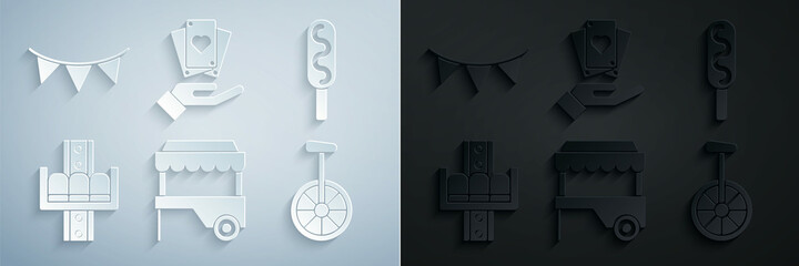 Set Fast street food cart with awning, Corn dog, Attraction carousel, Unicycle one wheel bicycle, Hand holding playing cards and Carnival garland flags icon. Vector © Oksana