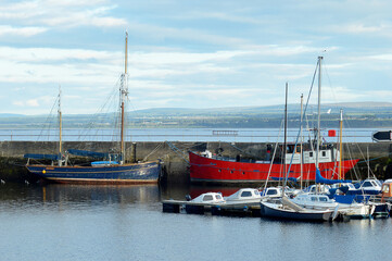 Boats morred in small Scottish harbour © douglasmack