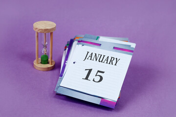 Calendar for January 15: loose-leaf calendar with the name of the month in English, number 15,...