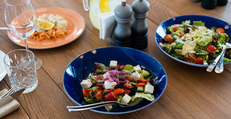 delicious dishes on the table in the restaurant. serving table. sharpness on glasses