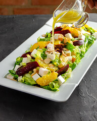 Beet, cheese, orange and sliced almond salad bathed in a delicious orange dressing.