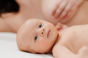 breastfeeding. the baby lies next to the mother after feeding