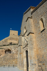 Fototapeta na wymiar View of the Santa Maria la Mayor church in Alcaudete (Spain) on a sunny winter morning