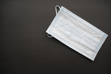 Medical mask isolated on background. Close-up of Coronavirus or COVID-19 protective face mask....