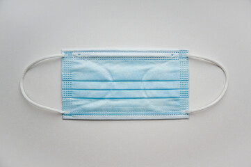 Medical mask isolated on background. Close-up of Coronavirus or COVID-19 protective face mask....