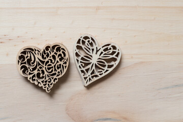fancy wooden hearts on a wooden surface