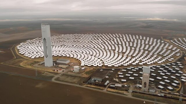 Aerial view Gemasolar Concentrated solar power plant or CSP in row, system generate solar power use mirrors lenses to concentrate large area of sunlight onto receiver, Seville, Andalusia, Spain