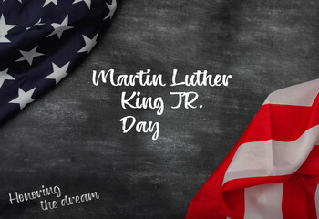 Fototapeta na wymiar Martin Luther King Day - American flag on blackboard