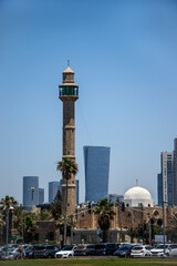 Fototapeta na wymiar architectural contrast in the city of Tel Aviv. Mosque and buildings.