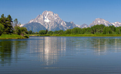 Grand Tetons mountain range summer reflection in the Snake River by Oxbow Bend, Grand Teton national park, Wyoming, USA.
