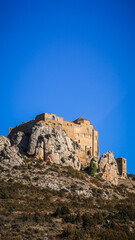 Fototapeta na wymiar The Castle of Loarre is a Romanesque Castle and Abbey located near the town of the same name in Aragon, Spain. There are great views of the Pyrenees all around it.