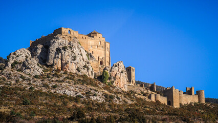 Fototapeta na wymiar The Castle of Loarre is a Romanesque Castle and Abbey located near the town of the same name in Aragon, Spain. There are great views of the Pyrenees all around it.