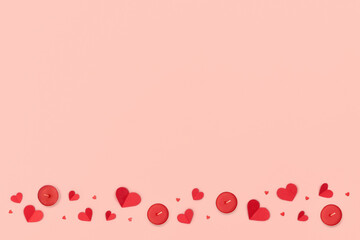 Valentines Day and Mother Day background. Red hearts and candles on pink background.