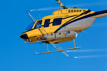 Close-up of yellow crop spraying helicopter