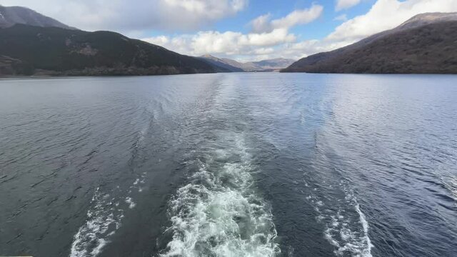 View of the ship's wake from the deck.Trace tail of speed boat on water surface in the sea