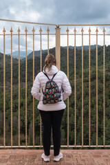 Girl on a balcony overlooking the valley