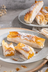Typical portuguese sweets Pasteis de Vouzela served on countertop. Filo pastry with egg cream filling