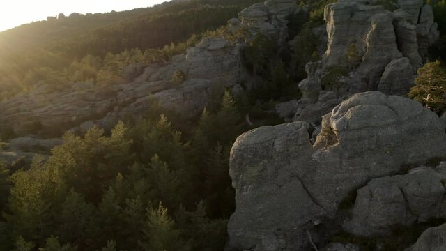 Aerial top view of suspension bridge, via ferrata in Spain. Hiking and climbing mountains, rocks, during sunset.
