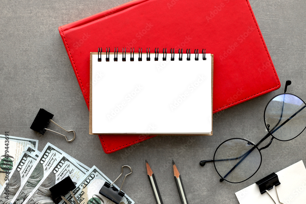 Poster stylish open notepad and pen on a red notepad, top view. place for text