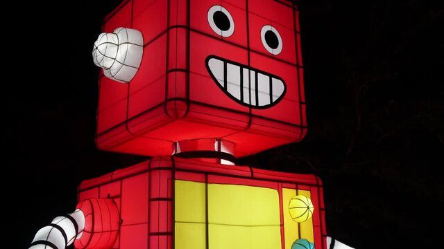 Illuminated robot figure in Christmas park