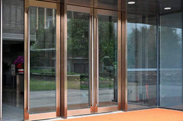 A glass door at the entrance to a commercial building