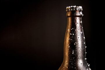 Bottle of beer with frosted ice