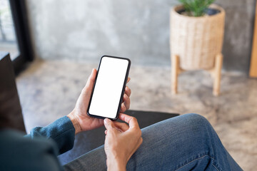 cell phone blank white screen mockup.hand holding texting using mobile on desk at office.background empty space for advertise.work people contact marketing business,technology