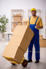 Young male contractor doing home relocation