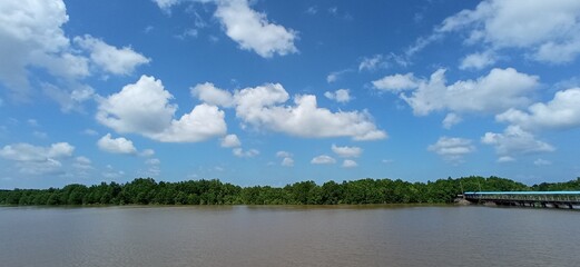 Obraz na płótnie Canvas Clouds Over The River