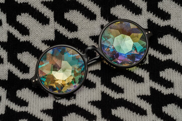 designer glasses with kaleidoscope glasses on a wool sweater