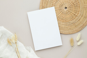 Blank paper cards, Greeting card Mockup with pampas grass on a wooden plate, beige background, Minimal beige workplace composition, flat lay, mockup