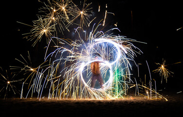 Fire show on the beach at night in Phuket, Thailand