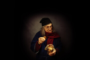 Scrooge wearing a cap and a scarf, putting gold coins in a jar - obrazy, fototapety, plakaty