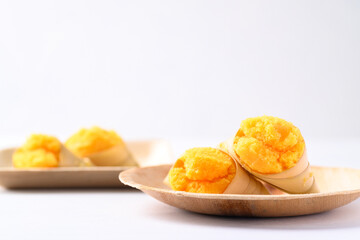 Homemade Toddy palm cake on natural plate with white background, Thai traditional dessert